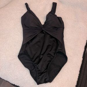 Miraclesuit black swimsuit sz 14. Slimming great condition deep v-neck one piece